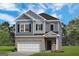 Charming new two-story home featuring gray siding, black shutters, and a brick-accented two-car garage at 10471 Trellis Lane (Lot 25), Hampton, GA 30228
