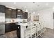 Modern kitchen with stainless steel appliances, white subway tile backsplash, and large center island at 10471 Trellis Lane (Lot 25), Hampton, GA 30228