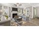 Bright and airy living room with fireplace, comfortable seating, and a view of the backyard at 10471 Trellis Lane (Lot 25), Hampton, GA 30228