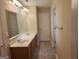 Well-lit bathroom features double vanity and neutral tile flooring at 2765 Turning Leaf Dr, Lawrenceville, GA 30044