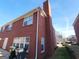 Angle view of the brick house showcasing a chimney and siding at 2765 Turning Leaf Dr, Lawrenceville, GA 30044