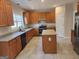 Spacious kitchen equipped with wooden cabinets, an island and modern appliances, perfect for cooking and entertaining at 2765 Turning Leaf Dr, Lawrenceville, GA 30044