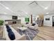Finished basement with a stone fireplace, TV, and comfortable seating at 102 Pinegate Rd, Peachtree City, GA 30269