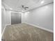 Bedroom with plush carpeting and large closet plus a ceiling fan at 102 Pinegate Rd, Peachtree City, GA 30269
