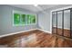 Bedroom featuring hardwood floors, ample natural light, and closet at 102 Pinegate Rd, Peachtree City, GA 30269