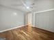 Spacious bedroom with hardwood floors and a ceiling fan at 102 Pinegate Rd, Peachtree City, GA 30269