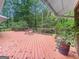 Deck area surrounded by trees featuring wood flooring and outdoor furniture at 102 Pinegate Rd, Peachtree City, GA 30269