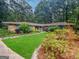 Charming single-story home with manicured front yard and mature trees at 102 Pinegate Rd, Peachtree City, GA 30269