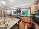 Kitchen with an island with seating and stainless steel appliances at 102 Pinegate Rd, Peachtree City, GA 30269