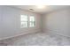 Neutral bedroom featuring carpet, with windows providing natural light at 2229 Rugby Avenue, Atlanta, GA 30337