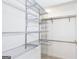 Organized walk-in closet with adjustable shelving, providing ample storage solutions at 2229 Rugby Avenue, Atlanta, GA 30337