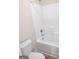 Bathroom featuring a toilet and shower-tub combination with white surround at 276 Arborview Dr, Mcdonough, GA 30252