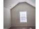 Bedroom features vaulted ceiling and good natural light from window at 276 Arborview Dr, Mcdonough, GA 30252