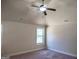 This bedroom offers a ceiling fan and a bright window for natural light at 276 Arborview Dr, Mcdonough, GA 30252