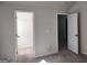 Bedroom with two doorway openings, carpet and neutral walls at 276 Arborview Dr, Mcdonough, GA 30252