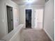 Upstairs hallway with neutral carpet leads to bedrooms at 276 Arborview Dr, Mcdonough, GA 30252