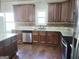 Modern kitchen features granite countertops, stainless steel appliances, and ample storage at 276 Arborview Dr, Mcdonough, GA 30252