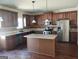 Modern kitchen with granite countertops, stainless steel appliances, and hardwood floors at 276 Arborview Dr, Mcdonough, GA 30252
