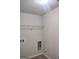 Laundry room features hookups for washer, dryer and basic wire shelving at 276 Arborview Dr, Mcdonough, GA 30252