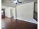 Spacious living area shows hardwood floors, kitchen, and stairway at 276 Arborview Dr, Mcdonough, GA 30252