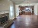 Open floor plan showcasing living room fireplace and spacious kitchen at 276 Arborview Dr, Mcdonough, GA 30252