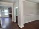 Bright living room showing hardwood floors, recessed lights, and view of kitchen at 276 Arborview Dr, Mcdonough, GA 30252