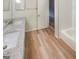 Bathroom boasts double vanity with granite countertop and a tile surround at 2725 St Augustine Trl, Marietta, GA 30067
