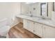 Bathroom with double vanity, granite countertops, white cabinets and tile flooring at 2725 St Augustine Trl, Marietta, GA 30067
