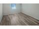 Bright empty bedroom showcasing hardwood floors and a window at 2725 St Augustine Trl, Marietta, GA 30067