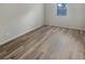 This bedroom has hard surface flooring, neutral paint and a window at 2725 St Augustine Trl, Marietta, GA 30067
