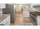 Modern kitchen featuring stainless steel appliances, granite countertops, and light wood floors at 2725 St Augustine Trl, Marietta, GA 30067