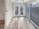 Bright sunroom with french doors and a modern ceiling fan at 2725 St Augustine Trl, Marietta, GA 30067