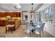 Open kitchen and breakfast nook featuring tile floors, stainless steel appliances, and natural light at 3736 Bloxham Ct, Atlanta, GA 30341