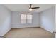 This bedroom features neutral carpet, a ceiling fan, and lots of natural light at 3232 Tarian Way, Decatur, GA 30034