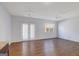 Open-concept living room featuring wood flooring and lots of natural light at 3232 Tarian Way, Decatur, GA 30034