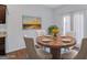 Staged dining area with a round table, chairs, and a view to the outside at 3232 Tarian Way, Decatur, GA 30034