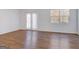 Sunny living room features wood floors, windows, and a sliding glass door at 3232 Tarian Way, Decatur, GA 30034