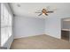 Empty bedroom with carpet, fan and a doorway to bathroom at 3232 Tarian Way, Decatur, GA 30034