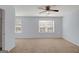 Spacious bedroom with carpeted floors and two windows for ample natural light at 3232 Tarian Way, Decatur, GA 30034