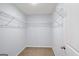 Walk-in closet with carpeted floor and white wire shelving for efficient storage at 3232 Tarian Way, Decatur, GA 30034