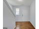 Bright entryway featuring wood flooring and a white front door at 3232 Tarian Way, Decatur, GA 30034