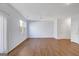Bright living room with lots of space, wood floors, a window, and two doors at 3232 Tarian Way, Decatur, GA 30034
