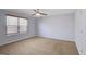 This spacious bedroom has neutral carpet, a ceiling fan, and lots of natural light at 3232 Tarian Way, Decatur, GA 30034