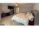 Spacious main bedroom with a plush bed, ceiling fan, and ample natural light at 1631 Royal Ives Dr, Lawrenceville, GA 30045