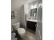 Well-lit powder room featuring a modern vanity and stylish decor at 1631 Royal Ives Dr, Lawrenceville, GA 30045