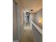 Upstairs hallway with carpet, neutral paint and access to multiple rooms at 1631 Royal Ives Dr, Lawrenceville, GA 30045