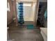 Well-lit bathroom featuring a tub with a shower and organized storage at 1631 Royal Ives Dr, Lawrenceville, GA 30045