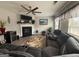 Spacious living room features a fireplace, plush sofa, and large windows for ample natural light at 1631 Royal Ives Dr, Lawrenceville, GA 30045
