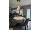 Bright dining area with stylish lighting and a round table, perfect for Gathering gatherings at 1631 Royal Ives Dr, Lawrenceville, GA 30045