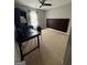 Neutral bedroom featuring a ceiling fan, desk, and carpet at 1631 Royal Ives Dr, Lawrenceville, GA 30045